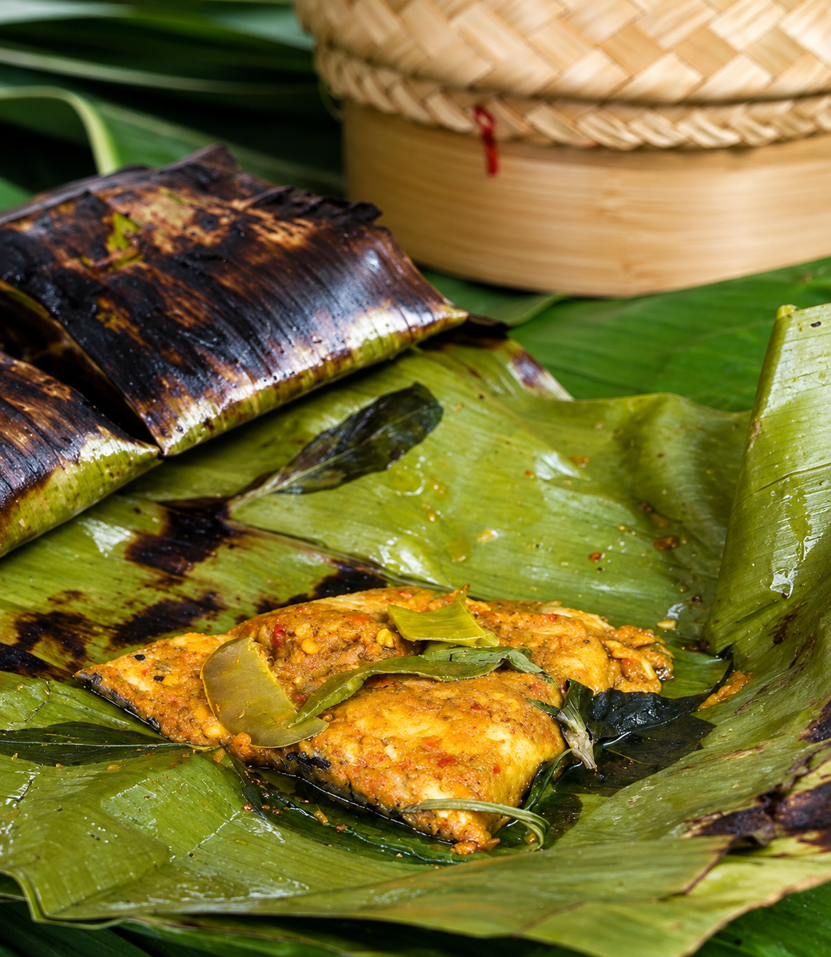 Fish wrapped in banana leaves grilled during Hoi An cooking class