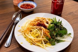Hoi An chicken rice with shredded chicken and herbs